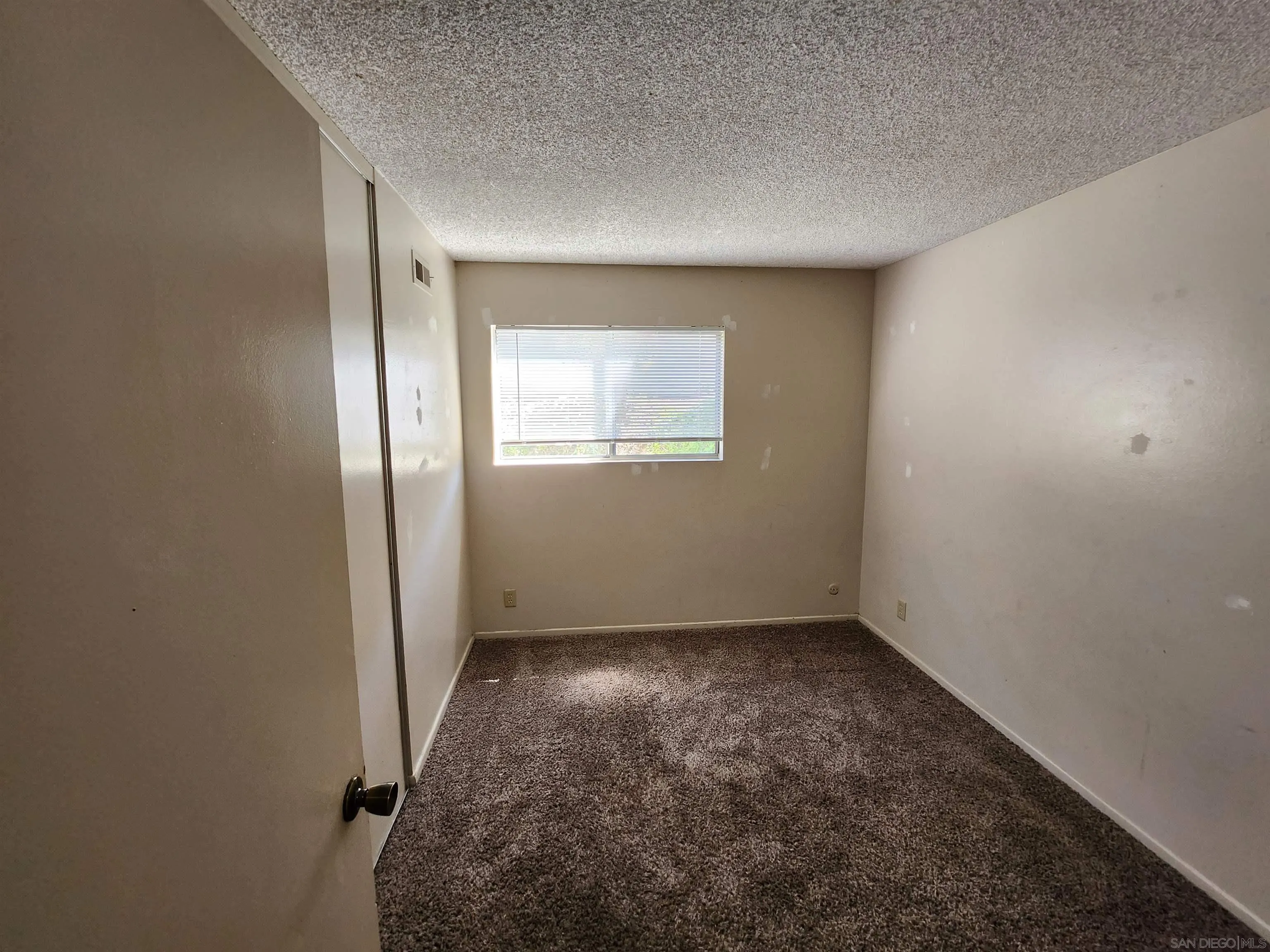 2017 Crofton Street Spring Valley, CA 91977 - Photo 7 of 13 an empty room with a empty space and windows