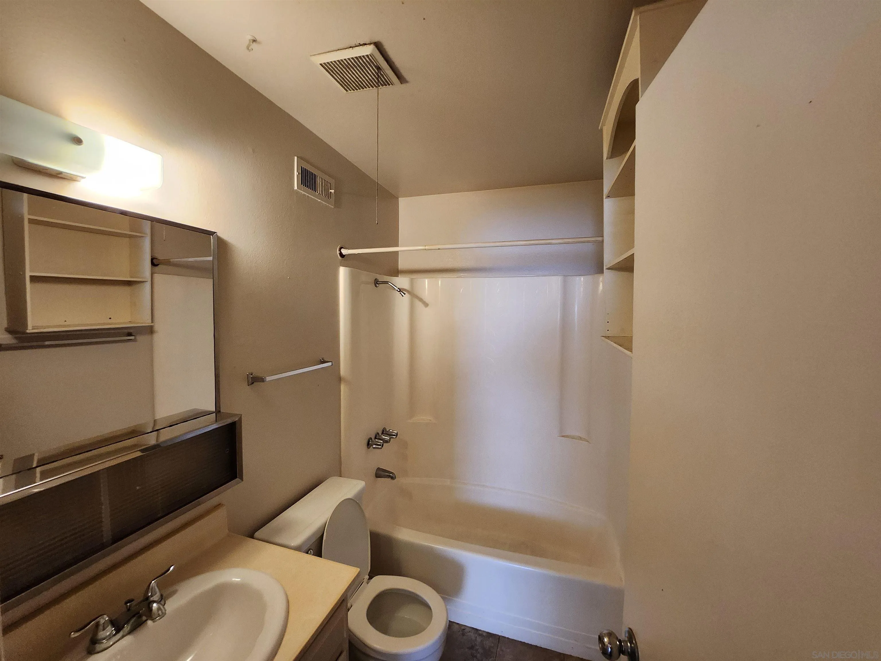 2017 Crofton Street Spring Valley, CA 91977 - Photo 8 of 13 a bathroom with a tub and a sink