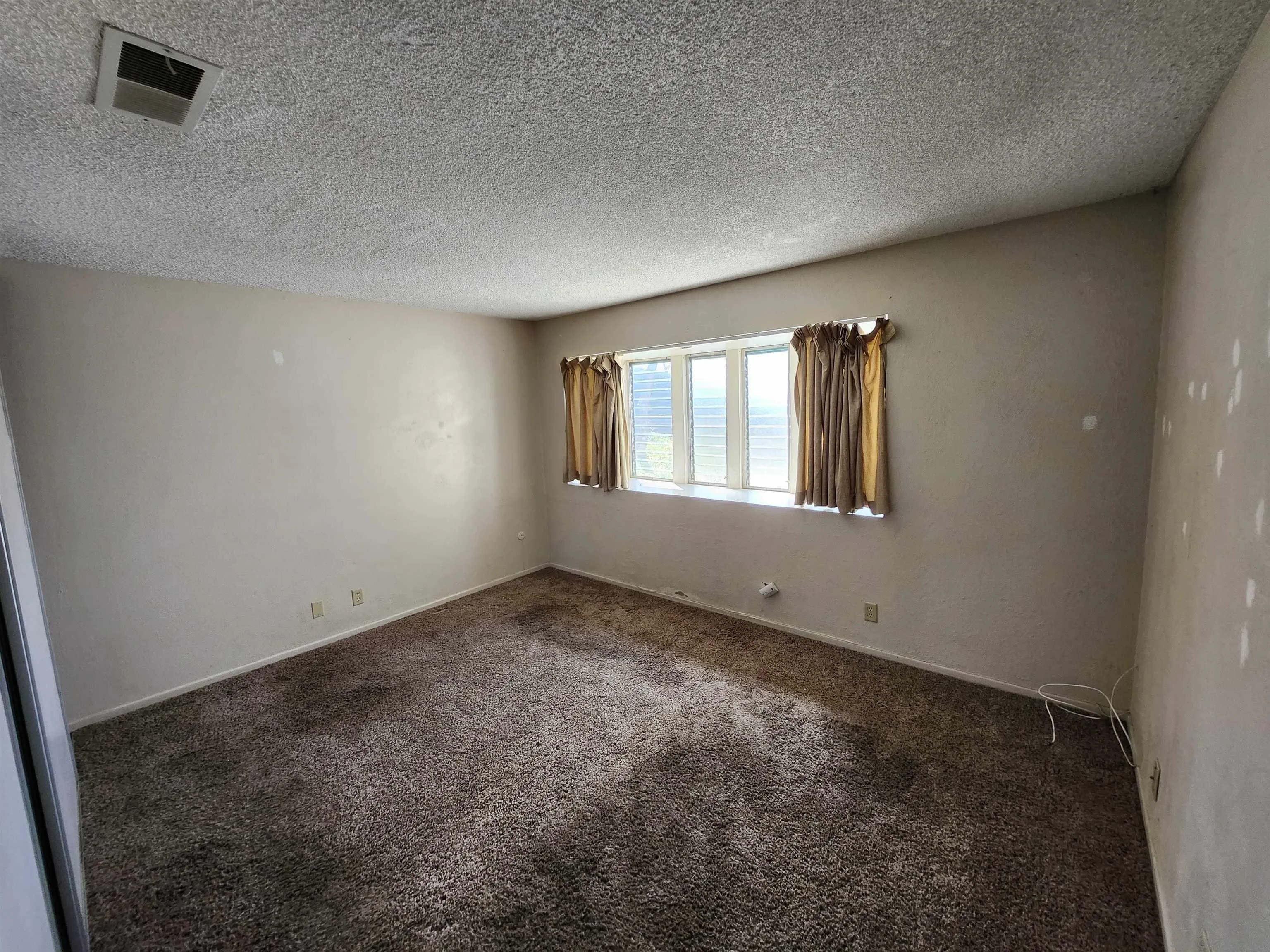 2017 Crofton Street Spring Valley, CA 91977 - Photo 9 of 13 an empty room with windows