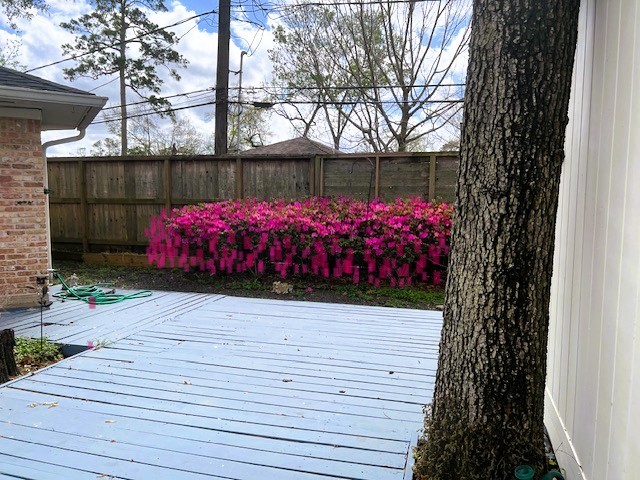 8639 Cedarbrake Drive Spring Valley Village, TX 77055 - Photo 20 of 26 Discover the perfect backyard oasis with a charming deck framed by vibrant azaleas, ideal for relaxing or entertaining amidst nature's beauty.