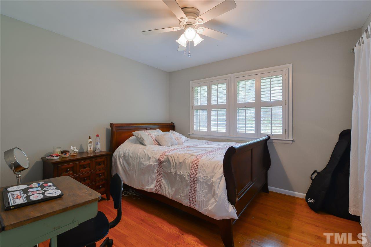 303 Glen Valley Road Raleigh, NC 27609 - Photo 19 of 24 a bedroom with a bed and a window