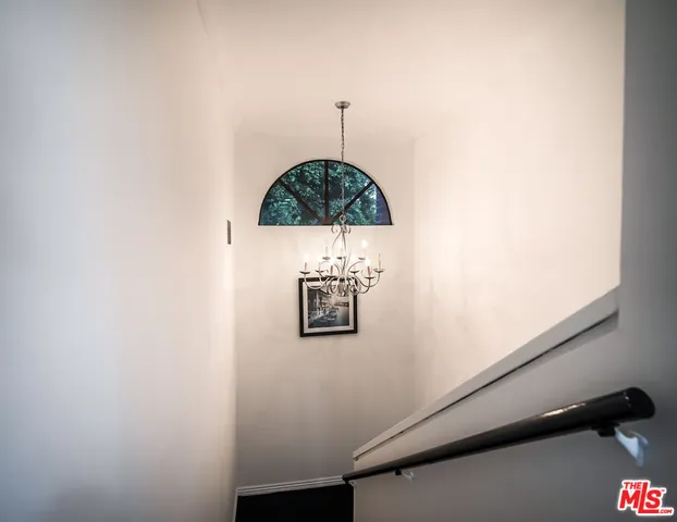 a bedroom with a bed and dresser