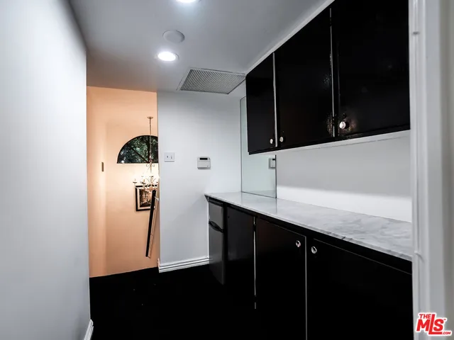 a room with a bed and a television