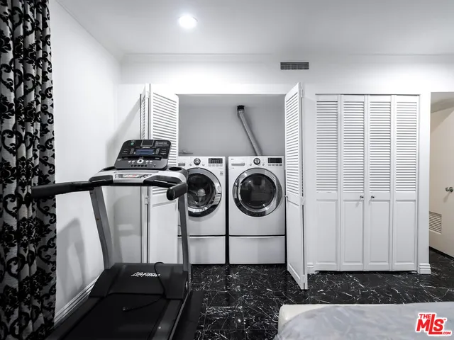 a bathroom with a toilet a sink and a mirror
