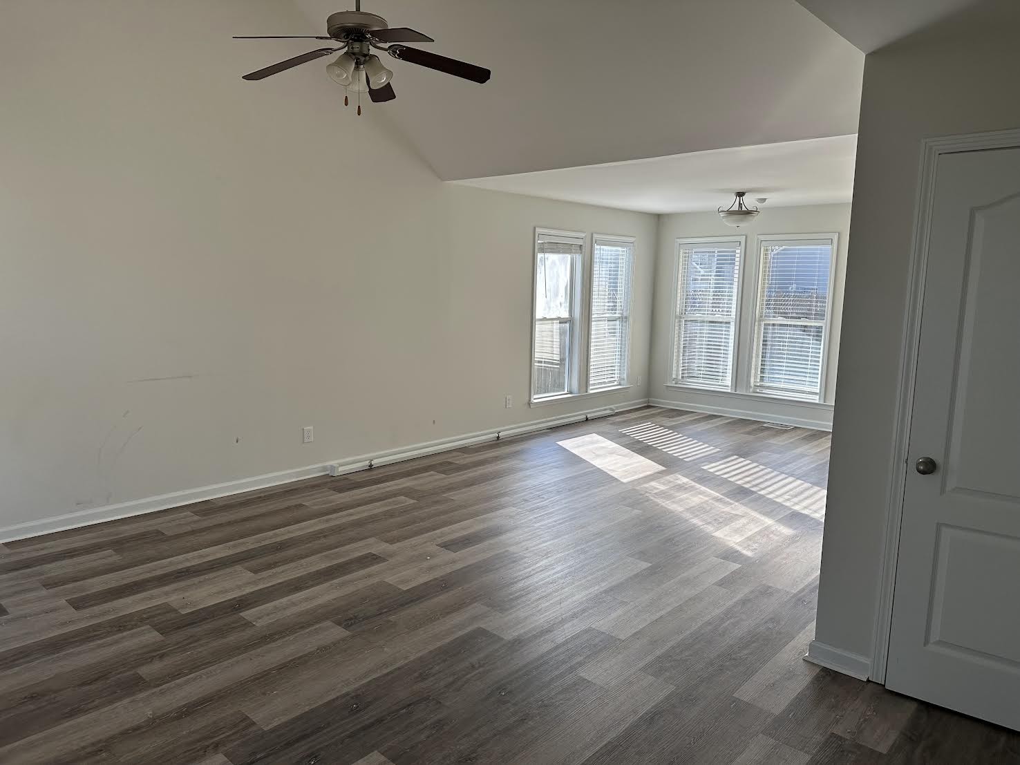 1556 Tylertown Road Clarksville, TN 37040 - Photo 2 of 10 wooden floor in an empty room with a window