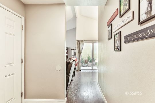 1023 North Norma Street Ridgecrest, CA 93555 - Photo 3 of 32 a view of a hallway with wooden floor and staircase