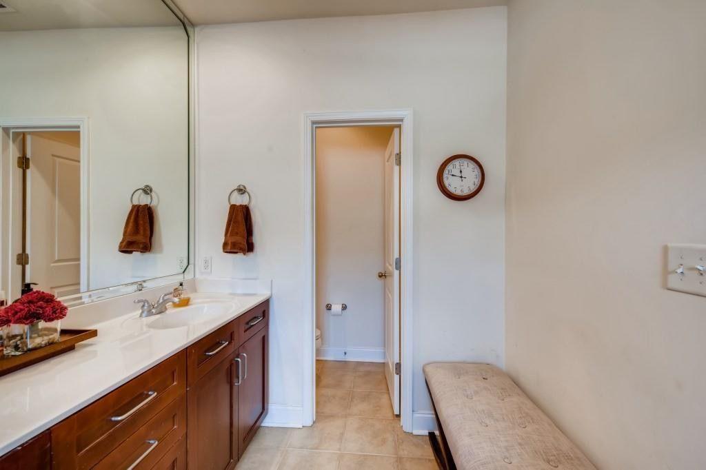 6001 Brookside Oak Circle Norcross, GA 30093 - Photo 19 of 40 a bathroom with a sink and a mirror