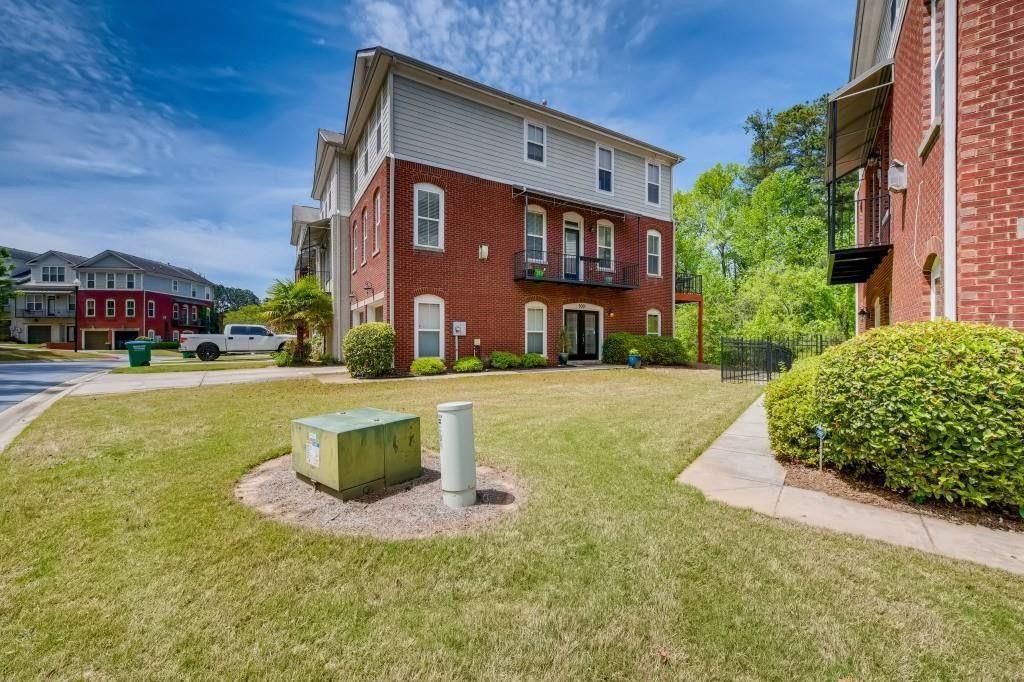 6001 Brookside Oak Circle Norcross, GA 30093 - Photo 2 of 40 a front view of building with yard