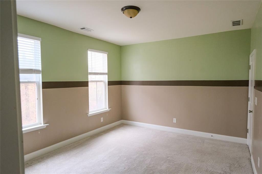 6001 Brookside Oak Circle Norcross, GA 30093 - Photo 24 of 40 a view of an empty room with a window