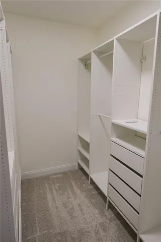 a view of an empty walk in closet