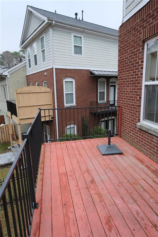 6001 Brookside Oak Circle Norcross, GA 30093 - Photo 33 of 40 a view of backyard with deck and wooden floor