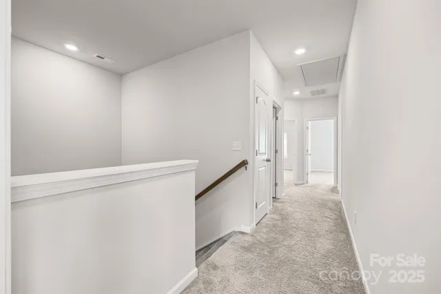 a view of a hallway with staircase