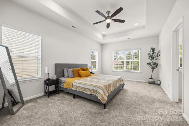 a bed room with a bed and a window