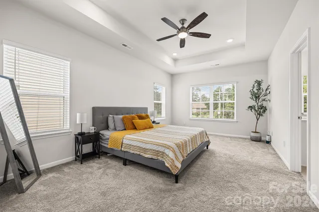 a bathroom with a sink a toilet and a window
