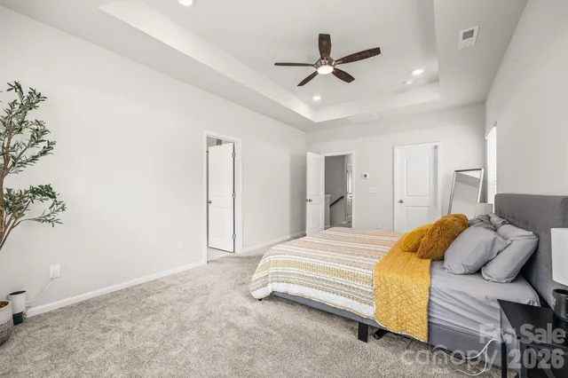 a spacious bathroom with a double vanity sink and a mirror