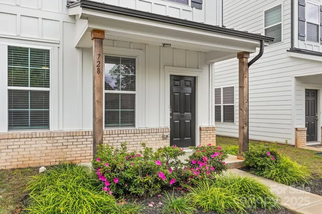 a view of a house with a potted plant