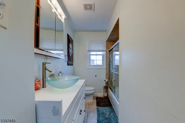 a bathroom with sink and mirror