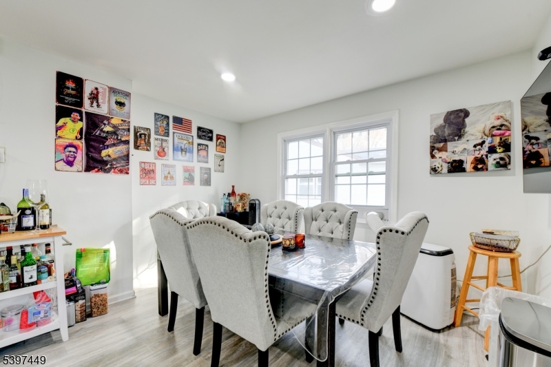 8 Sailer Court Elizabeth, NJ 07201 - Photo 16 of 27 a view of a dining room with furniture a rug and wooden floor
