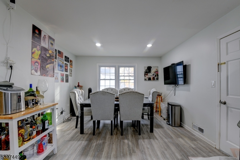 8 Sailer Court Elizabeth, NJ 07201 - Photo 17 of 27 a view of a dining room with furniture and wooden floor