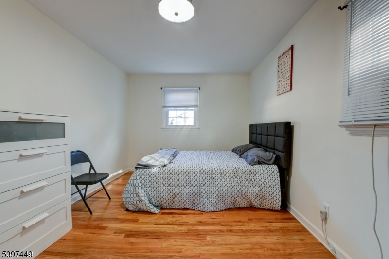 8 Sailer Court Elizabeth, NJ 07201 - Photo 19 of 27 a bedroom with a bed and a window