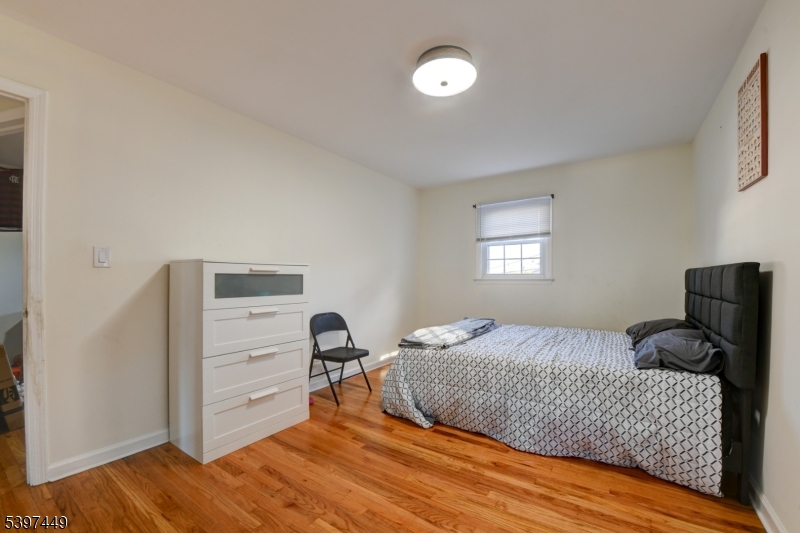 8 Sailer Court Elizabeth, NJ 07201 - Photo 20 of 27 a bedroom with a bed and a window