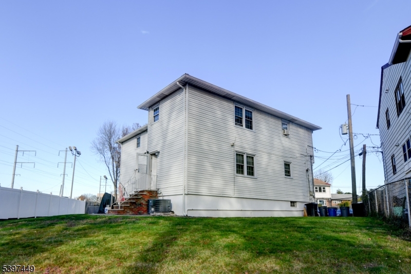 8 Sailer Court Elizabeth, NJ 07201 - Photo 26 of 27 a view of house with backyard