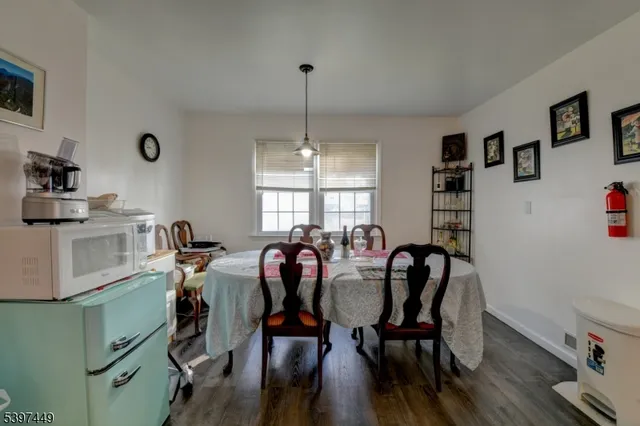a view of a dining room with furniture and window