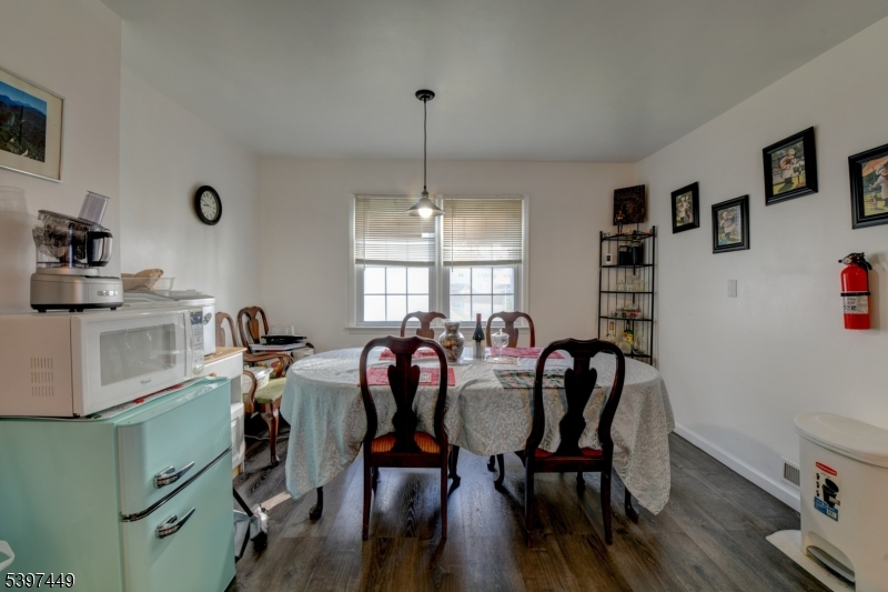 8 Sailer Court Elizabeth, NJ 07201 - Photo 7 of 27 a view of a dining room with furniture and window