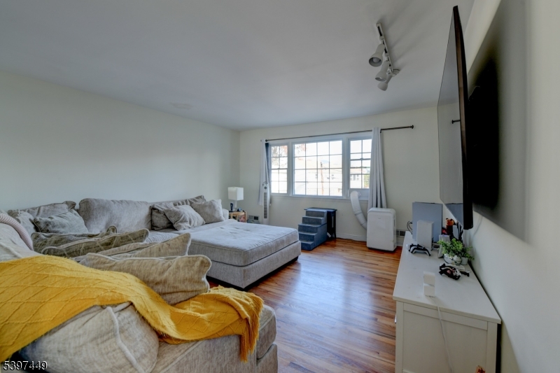 8 Sailer Court Elizabeth, NJ 07201 - Photo 9 of 27 a bedroom with furniture and a window