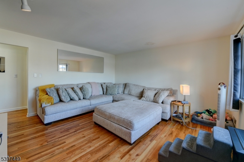 8 Sailer Court Elizabeth, NJ 07201 - Photo 10 of 27 a living room with furniture and a wooden floor