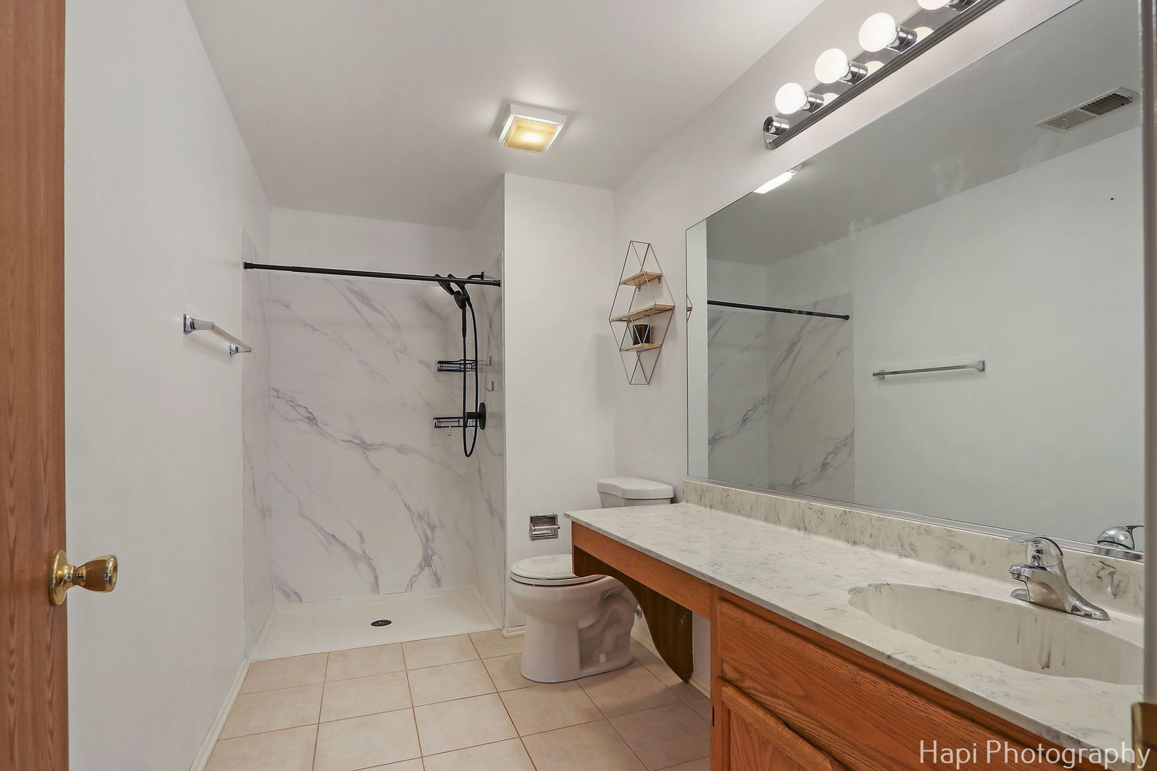 370 Ashford Circle, Unit 2 Bartlett, IL 60103 - Photo 14 of 23 a bathroom with a sink a toilet and shower