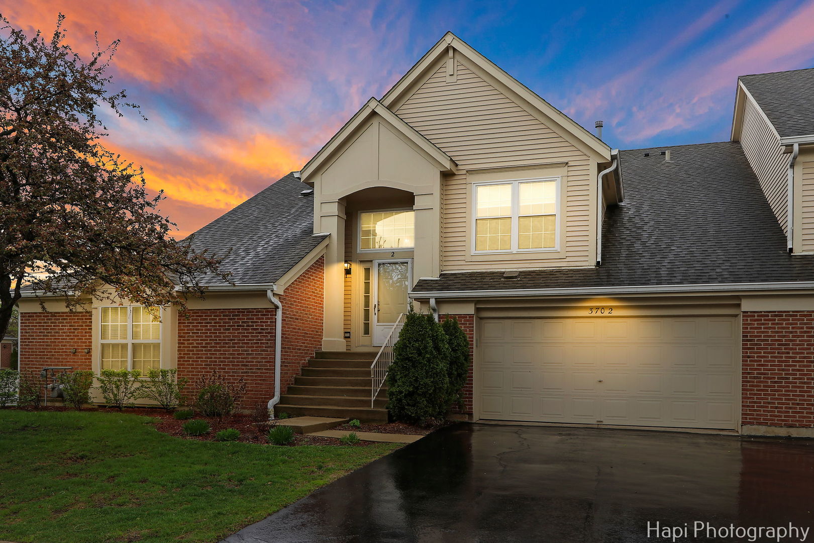 370 Ashford Circle, Unit 2 Bartlett, IL 60103 - Photo 21 of 23 a front view of a house with garden
