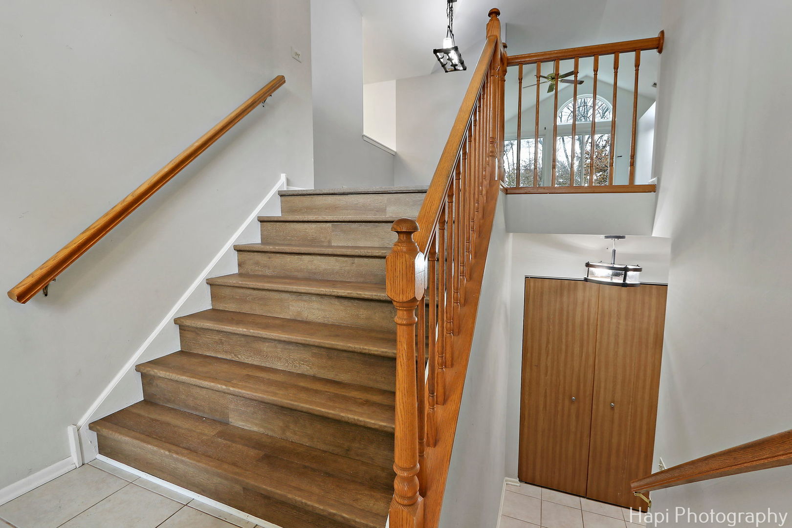 370 Ashford Circle, Unit 2 Bartlett, IL 60103 - Photo 3 of 23 a view of staircase with wooden floor and a window