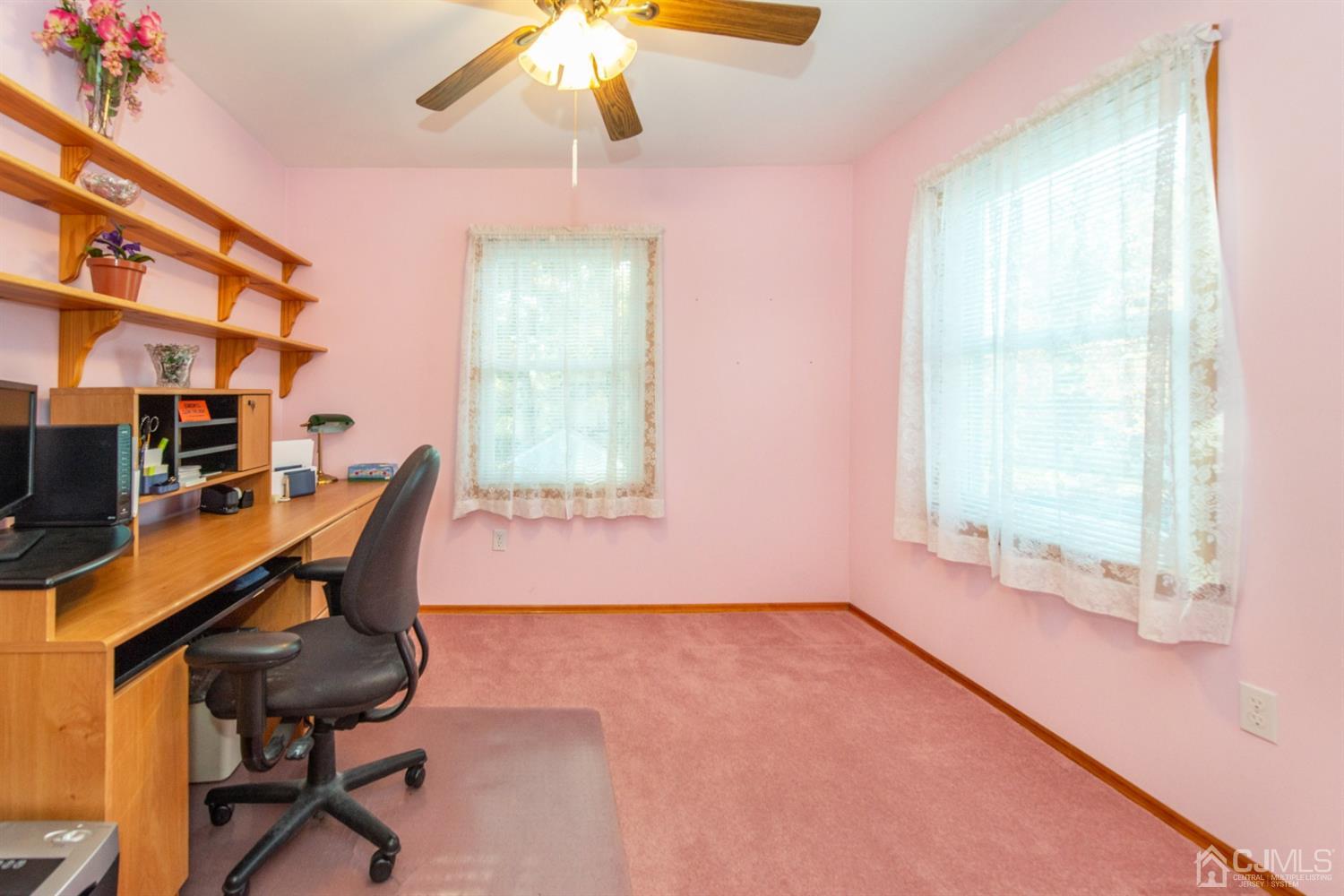 105 Highfield Road Colonia, NJ 07067 - Photo 22 of 22 a view of a workspace with furniture and a window