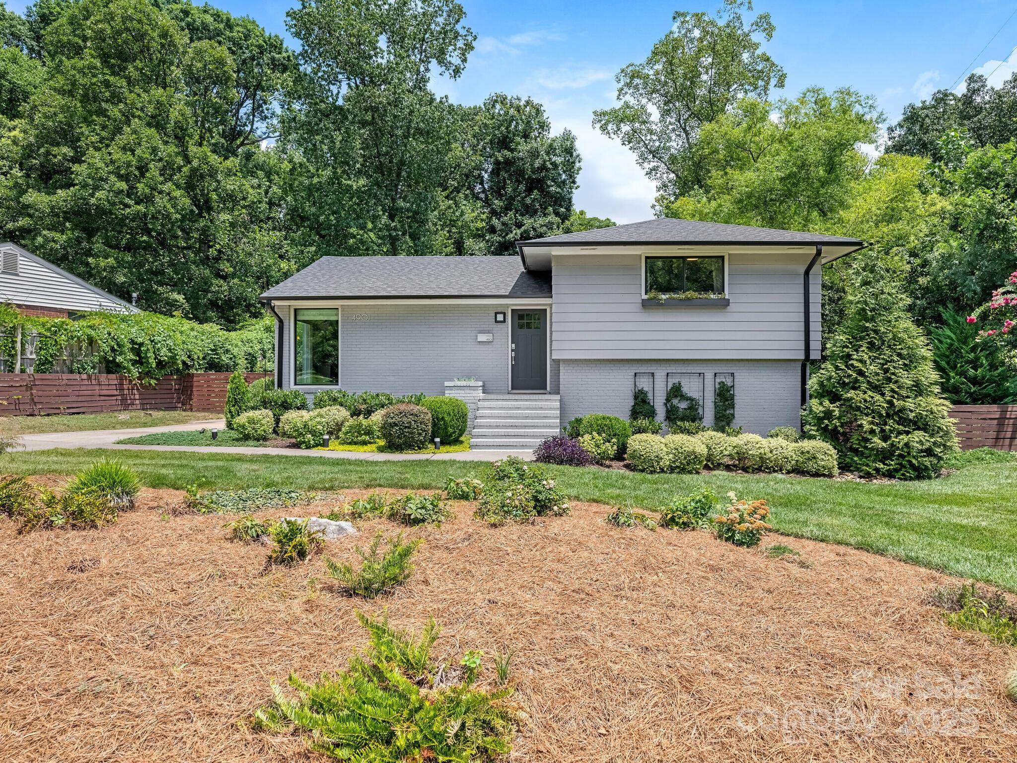 4901 Murrayhill Road Charlotte, NC 28209 - Photo 1 of 28 a front view of a house with a yard