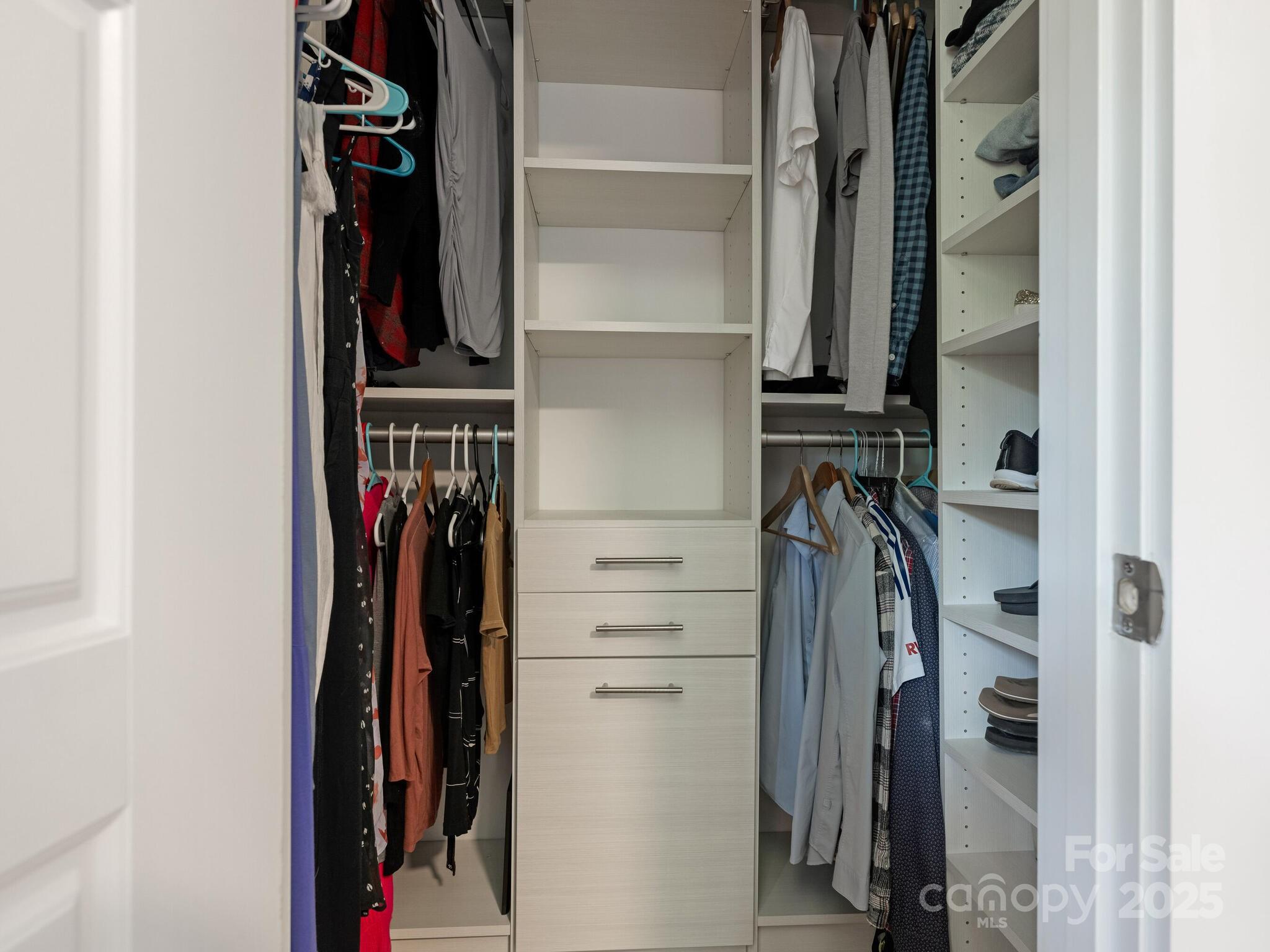 4901 Murrayhill Road Charlotte, NC 28209 - Photo 12 of 28 a view of walk in closet with clothes and shoes