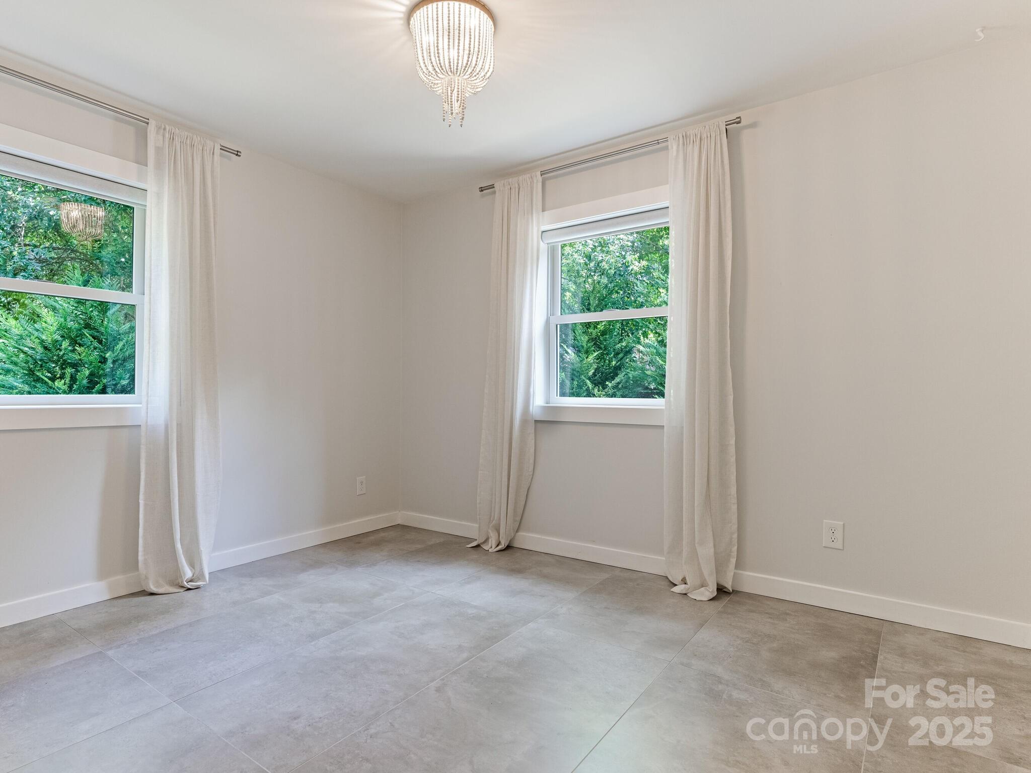 4901 Murrayhill Road Charlotte, NC 28209 - Photo 19 of 28 an empty room with a window