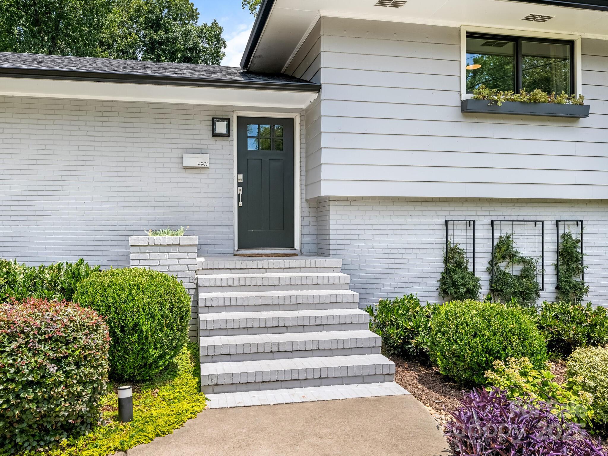 4901 Murrayhill Road Charlotte, NC 28209 - Photo 2 of 28 a front view of a house with a yard