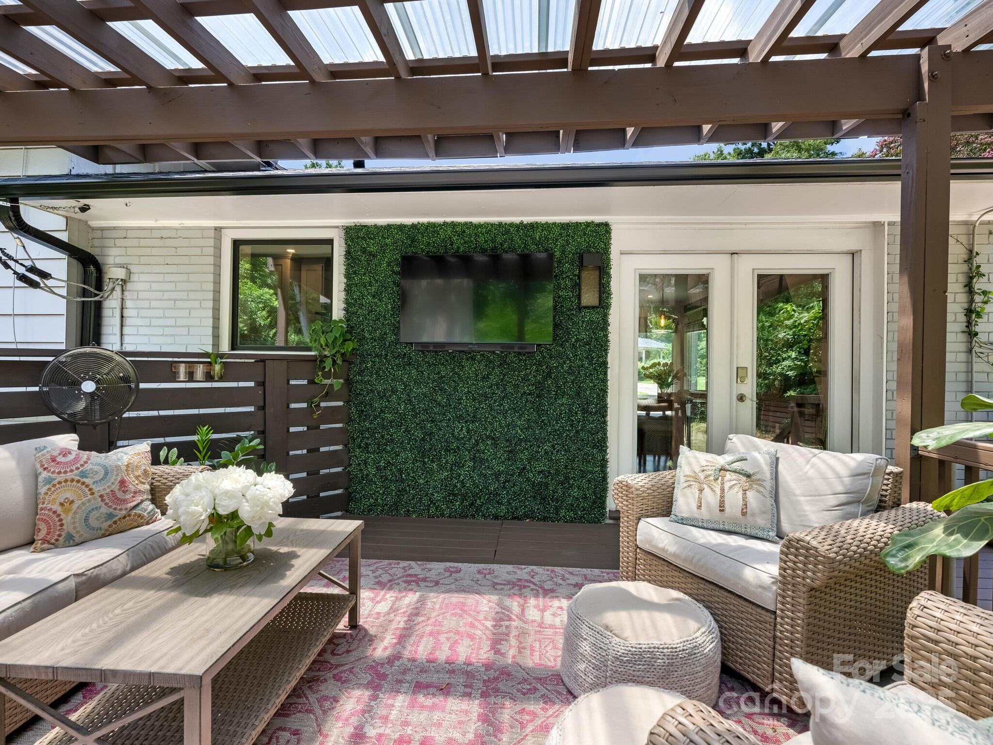 4901 Murrayhill Road Charlotte, NC 28209 - Photo 25 of 28 a outdoor living space with furniture and a fireplace