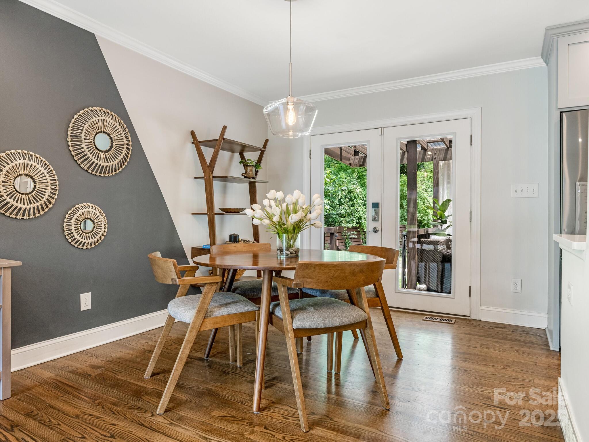 4901 Murrayhill Road Charlotte, NC 28209 - Photo 5 of 28 a view of a dining room with furniture window and wooden floor