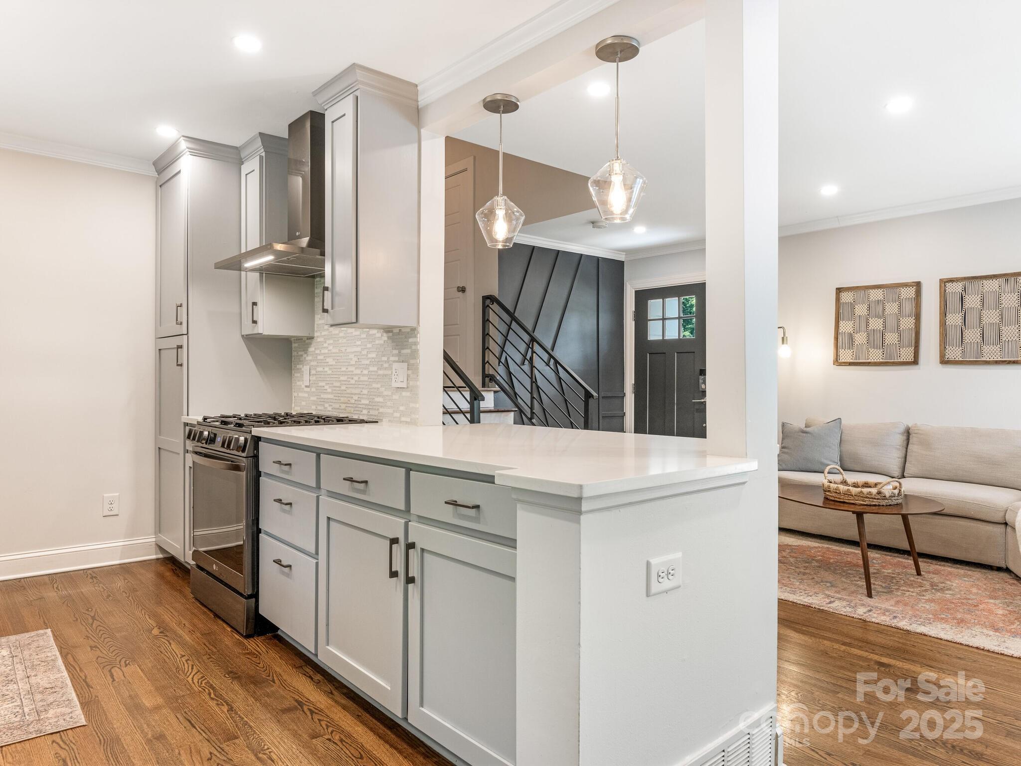 4901 Murrayhill Road Charlotte, NC 28209 - Photo 8 of 28 a kitchen with granite countertop a sink a stove and a refrigerator