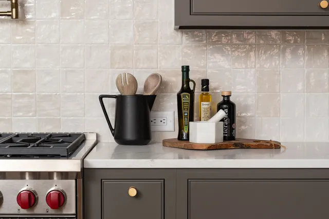 a living room with large window and furniture