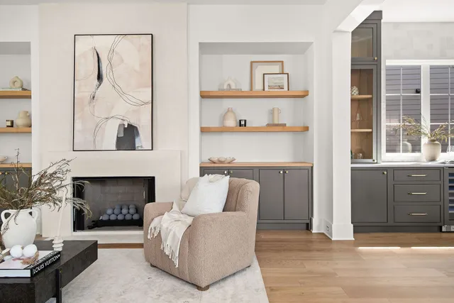 a view of a hallway with wooden floor and windows