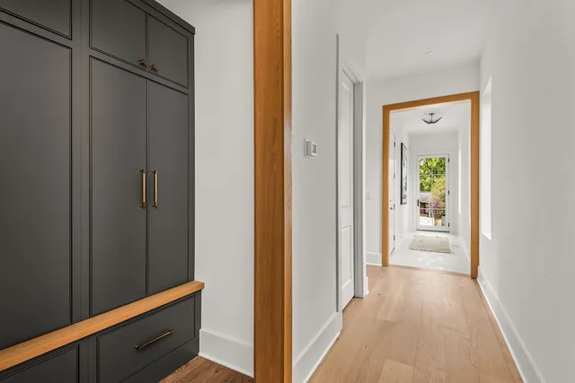 a bedroom with bed and a potted plant