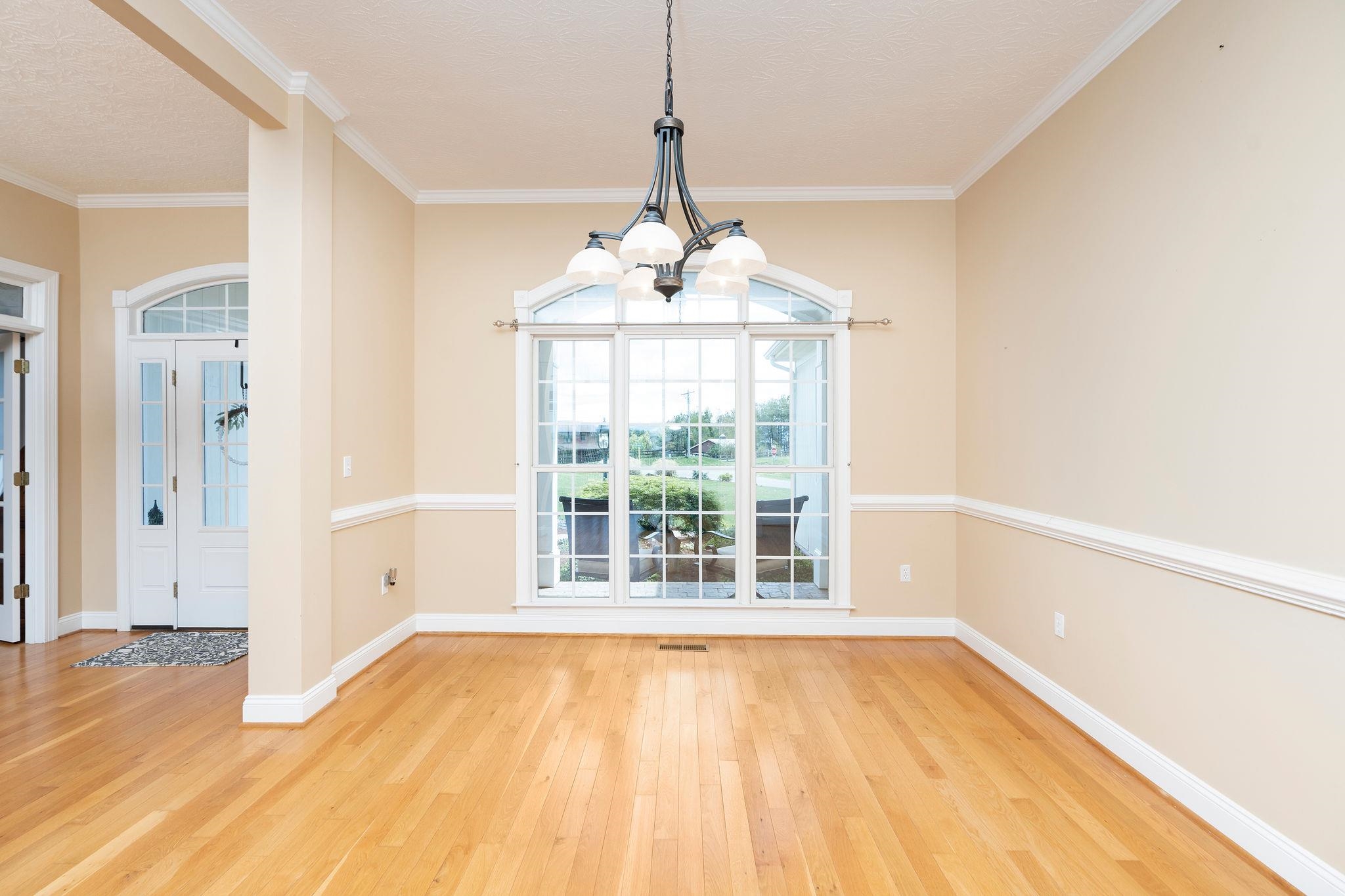 12 Ridgemore Drive Raphine, VA 24472 - Photo 14 of 75 a view of an empty room with wooden floor and a window