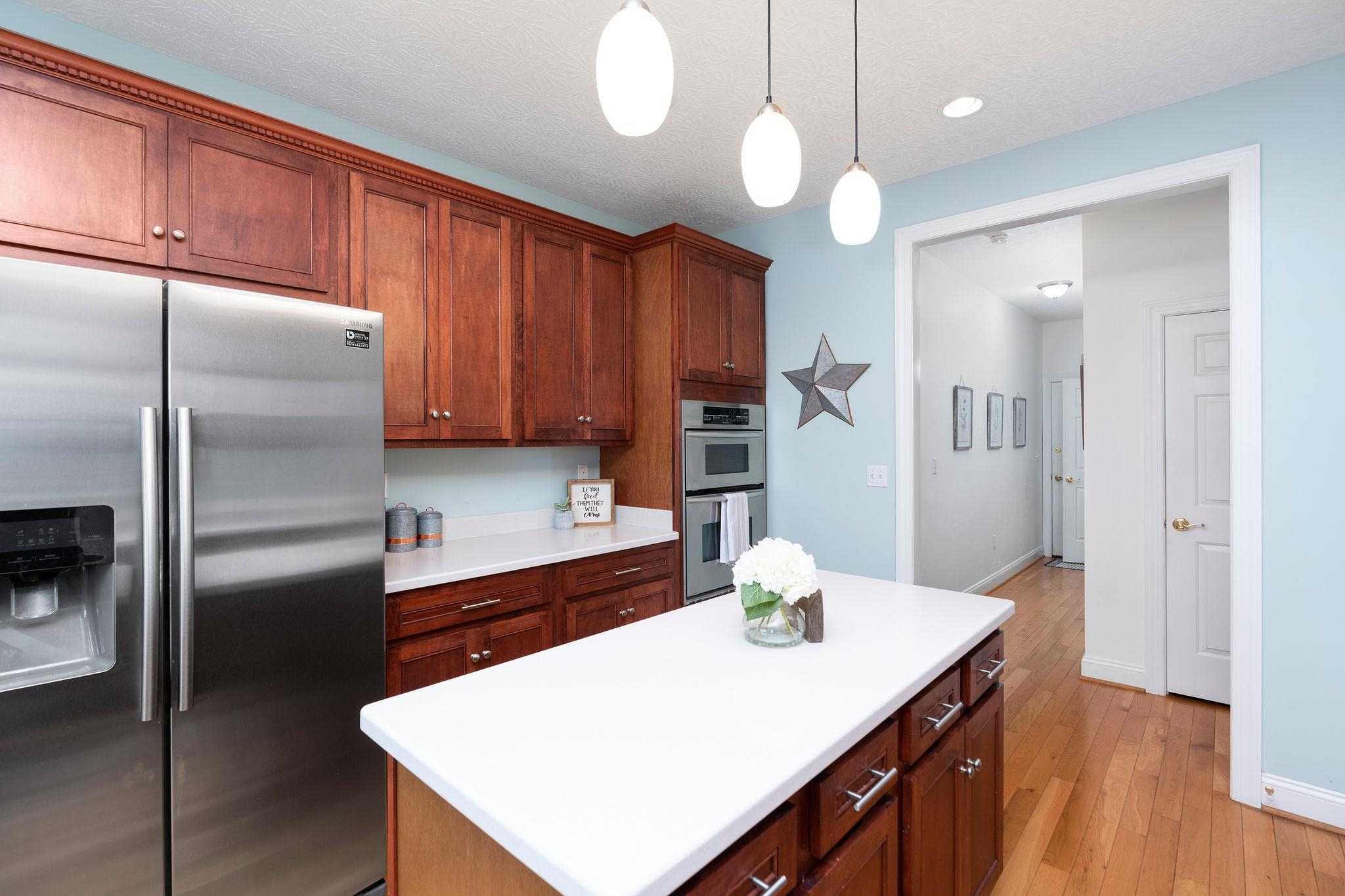 12 Ridgemore Drive Raphine, VA 24472 - Photo 21 of 75 a kitchen with kitchen island a counter space a sink appliances and cabinets