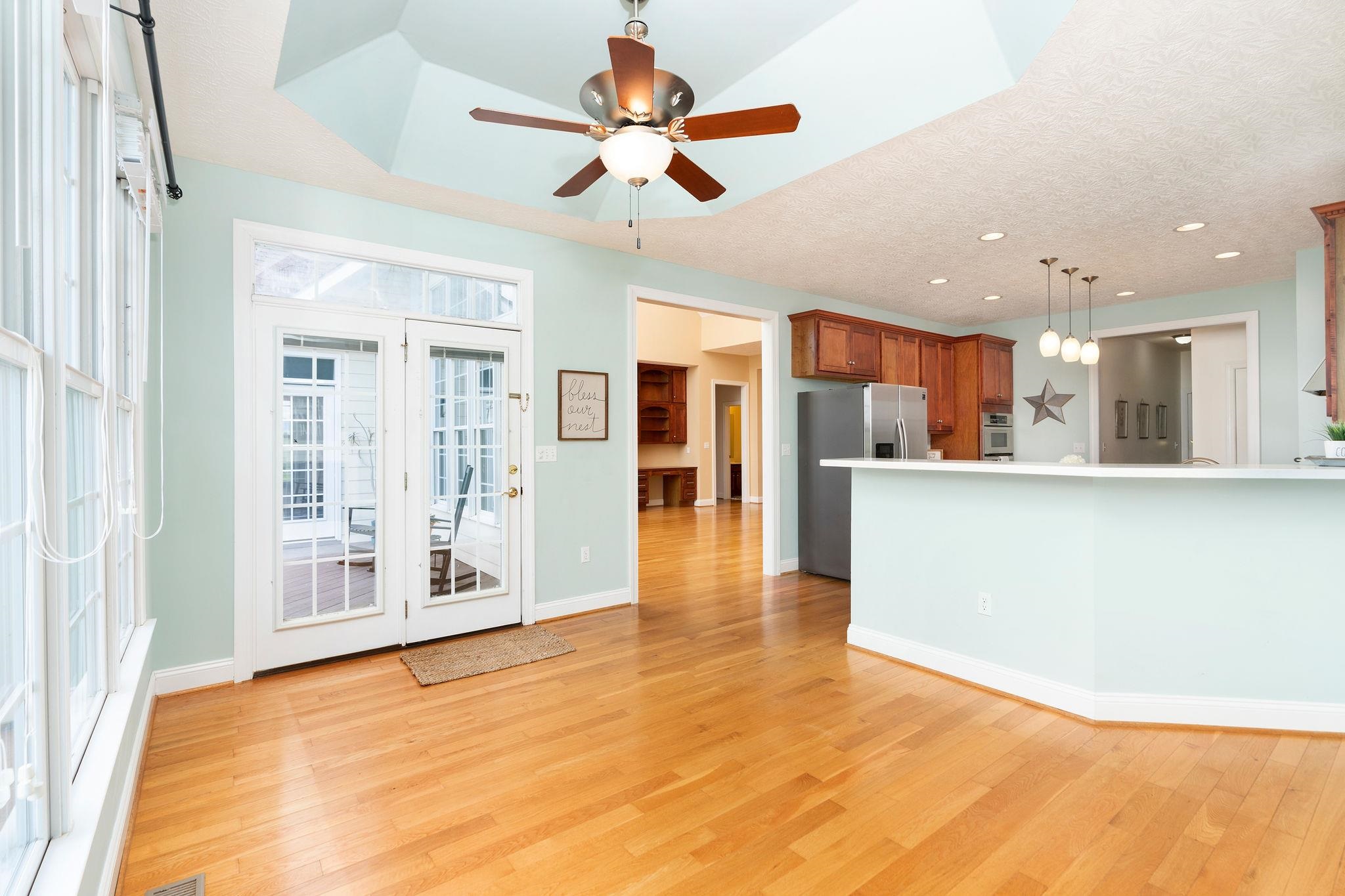 12 Ridgemore Drive Raphine, VA 24472 - Photo 25 of 75 a view of a kitchen with kitchen island stainless steel appliances wooden floor and a window