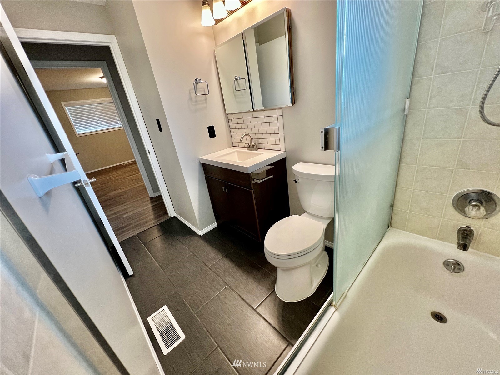 1067 Anacortes Avenue Northeast Renton, WA 98059 - Photo 14 of 18 a bathroom with a sink and a mirror