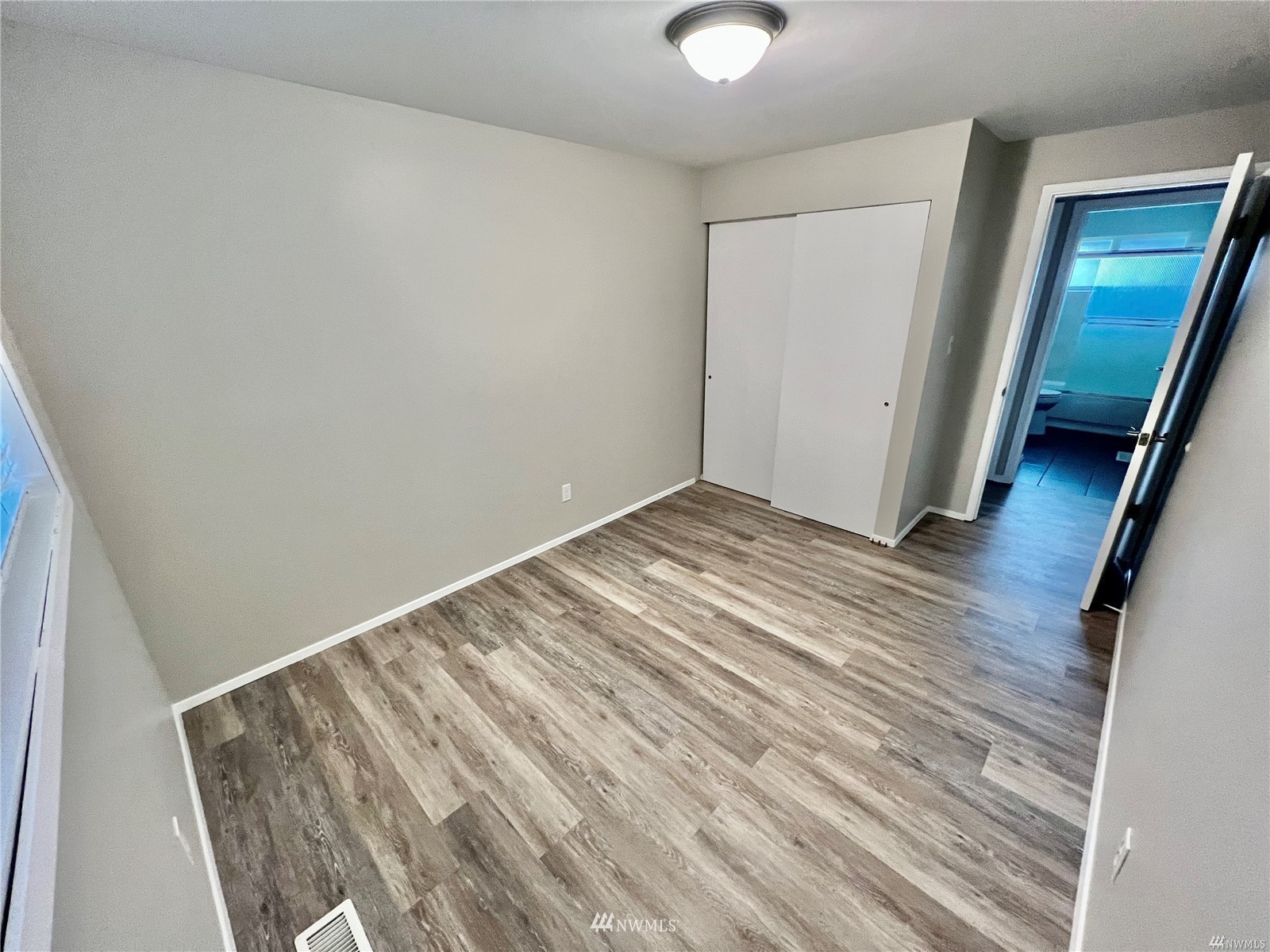 1067 Anacortes Avenue Northeast Renton, WA 98059 - Photo 17 of 18 a view of empty room with wooden floor
