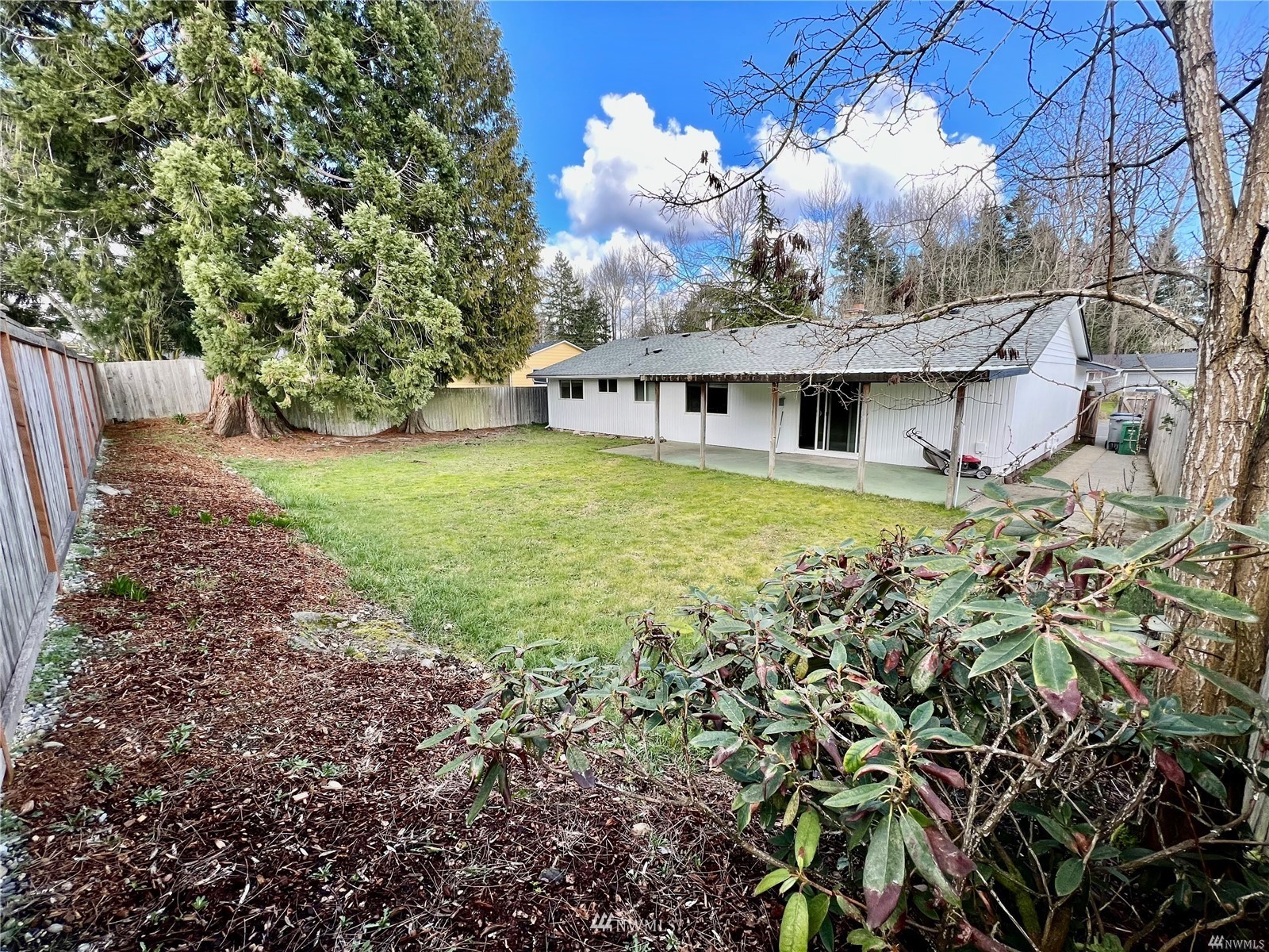 1067 Anacortes Avenue Northeast Renton, WA 98059 - Photo 18 of 18 a view of a house with a yard